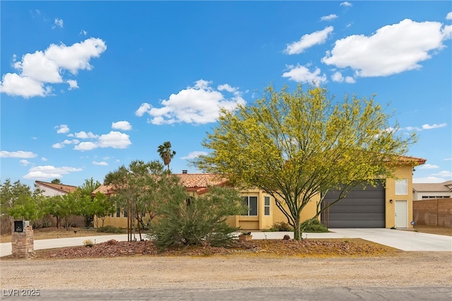 4185 W Arby Ave, Las Vegas, NV 89118 - obstructed view of property featuring stucco siding, driveway, an attached garage, and a tiled roof