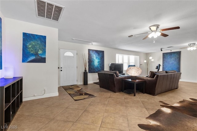 4185 W Arby Ave, Las Vegas, NV 89118 - living area featuring light tile patterned floors, ceiling fan, baseboards, and track lighting