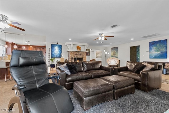 4185 W Arby Ave, Las Vegas, NV 89118 - living room with a ceiling fan, a fireplace, recessed lighting, and plenty of natural light
