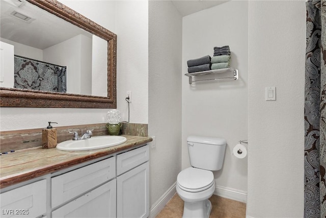 4185 W Arby Ave, Las Vegas, NV 89118 - bathroom with toilet, vanity, baseboards, and tile patterned flooring