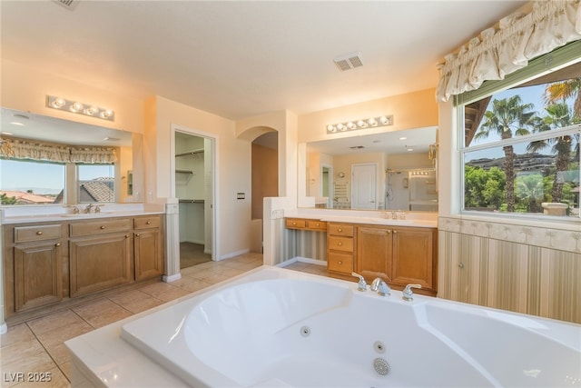 395 Suzanne Peak Ct, Henderson, NV 89012 - full bath with a shower stall, a jetted tub, vanity, and healthy amount of natural light