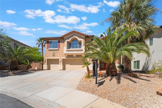 395 Suzanne Peak Ct, Henderson, NV 89012 - mediterranean / spanish home with stucco siding, driveway, an attached garage, and a tiled roof