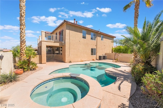 395 Suzanne Peak Ct, Henderson, NV 89012 - view of swimming pool with a fenced backyard and a pool with connected hot tub