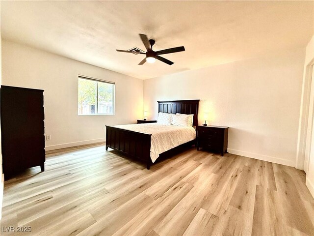 4881 E Imperial Ave, Las Vegas, NV 89104 - bedroom with light wood-style floors, baseboards, and a ceiling fan