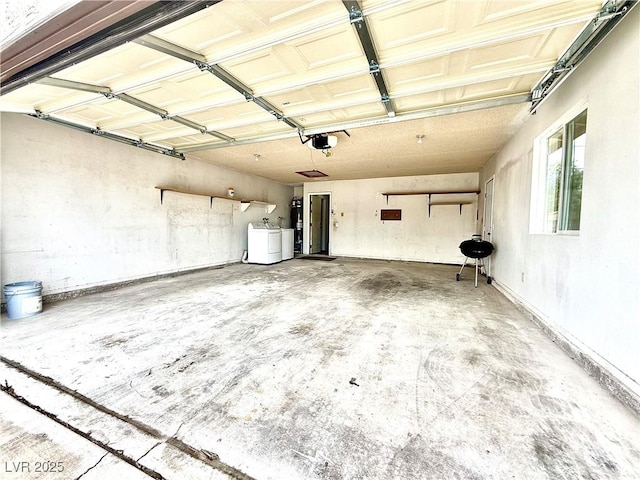 4881 E Imperial Ave, Las Vegas, NV 89104 - garage with independent washer and dryer, a garage door opener, and strapped water heater