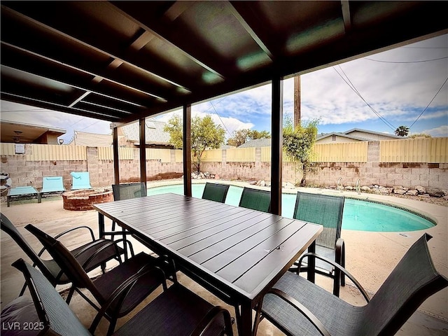4881 E Imperial Ave, Las Vegas, NV 89104 - view of patio with a fenced backyard, outdoor dining area, and an outdoor fire pit