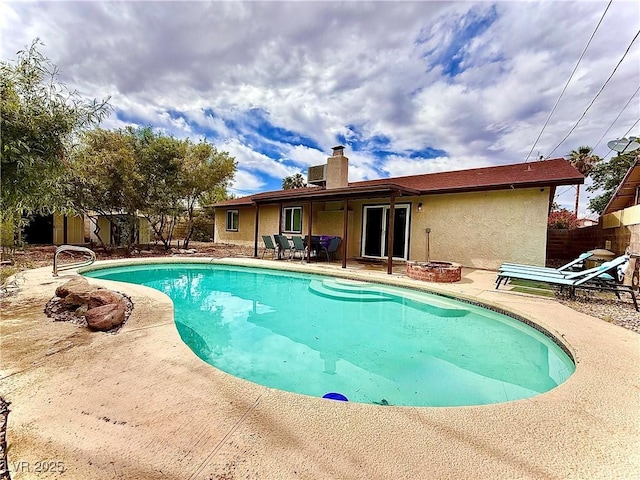 4881 E Imperial Ave, Las Vegas, NV 89104 - view of pool with a patio area, fence, and an outdoor fire pit
