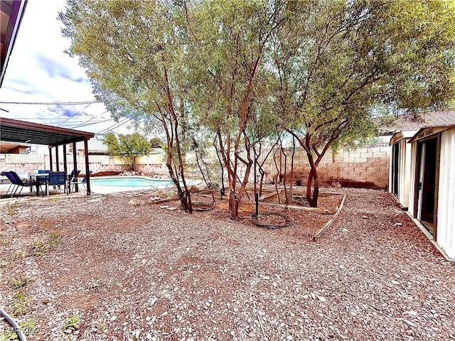 4881 E Imperial Ave, Las Vegas, NV 89104 - fenced backyard with a patio area