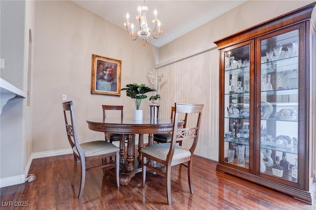 5000 Red Rock St Unit 237, Las Vegas, NV 89118 - dining room featuring a chandelier, wood finished floors, and baseboards