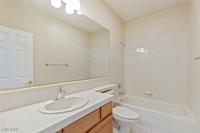 10761 Capesthorne Way, Las Vegas, NV 89135 - full bathroom featuring toilet, shower / bath combination, vanity, decorative backsplash, and tile patterned floors