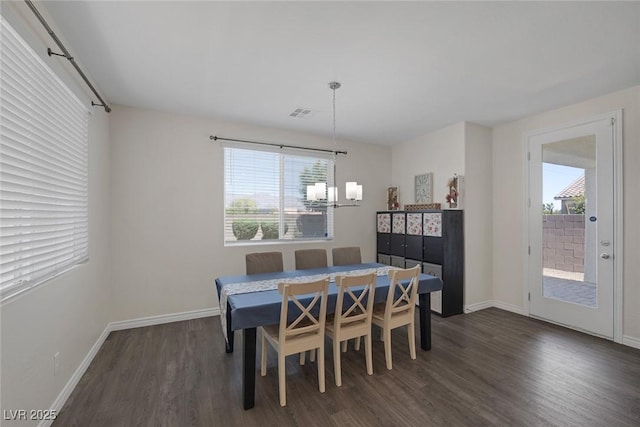 4050 Midnight Crest Ave, North Las Vegas, NV 89031 - dining room with a chandelier, plenty of natural light, dark wood-style flooring, and baseboards