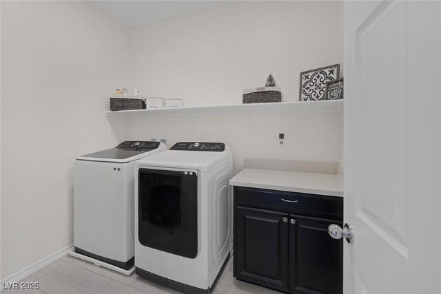 4050 Midnight Crest Ave, North Las Vegas, NV 89031 - laundry room with washer and dryer, cabinet space, baseboards, and light tile patterned flooring
