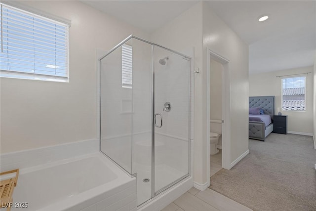 4050 Midnight Crest Ave, North Las Vegas, NV 89031 - full bathroom with toilet, a stall shower, ensuite bathroom, baseboards, and a garden tub