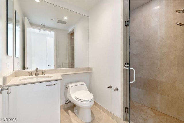 bathroom featuring a shower stall, toilet, vanity, and recessed lighting