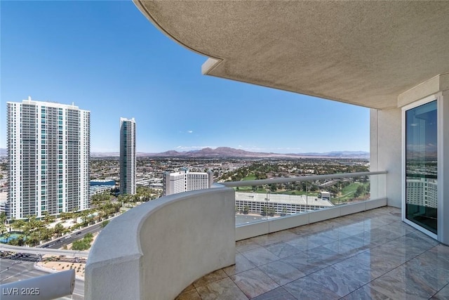 balcony featuring a mountain view