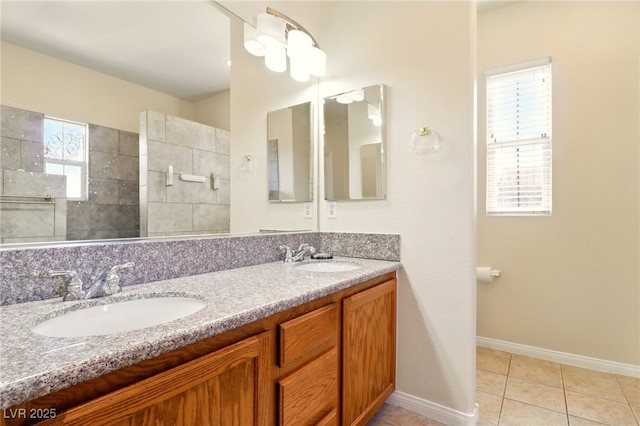 5380 Flowing Spring St, Las Vegas, NV 89122 - bathroom featuring double vanity, a walk in shower, and tile patterned floors