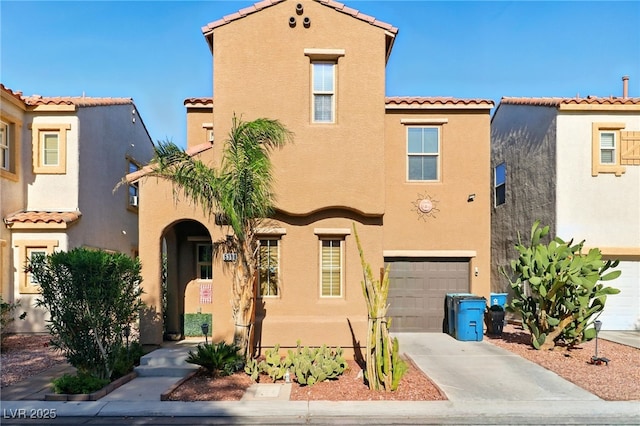 5380 Flowing Spring St, Las Vegas, NV 89122 - mediterranean / spanish-style house featuring stucco siding, an attached garage, and a tiled roof