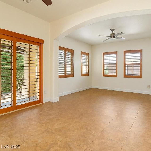 5380 Flowing Spring St, Las Vegas, NV 89122 - unfurnished room with ceiling fan and arched walkways