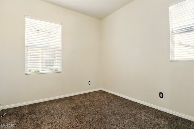 5380 Flowing Spring St, Las Vegas, NV 89122 - spare room with dark colored carpet and plenty of natural light