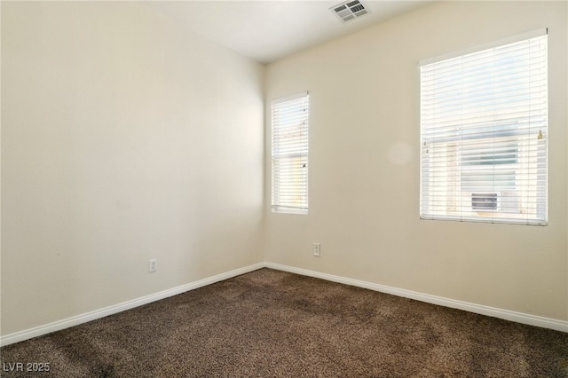 5380 Flowing Spring St, Las Vegas, NV 89122 - empty room featuring dark carpet and baseboards