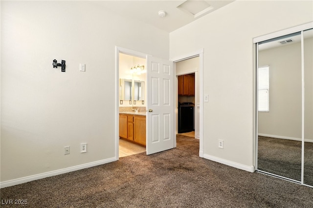 5380 Flowing Spring St, Las Vegas, NV 89122 - unfurnished bedroom featuring a closet, carpet floors, and ensuite bath