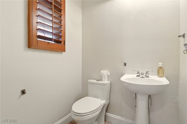 5380 Flowing Spring St, Las Vegas, NV 89122 - half bath featuring toilet and baseboards