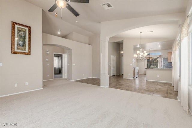8266 Lincoln Valley St, Las Vegas, NV 89123 - unfurnished living room featuring lofted ceiling, ceiling fan, light carpet, a chandelier, and arched walkways