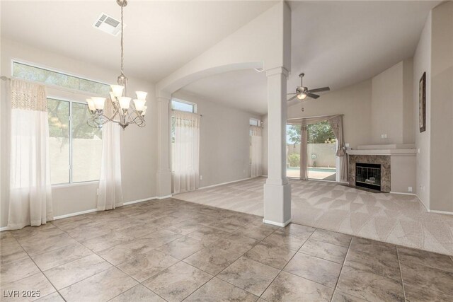 8266 Lincoln Valley St, Las Vegas, NV 89123 - unfurnished living room featuring lofted ceiling, a chandelier, a ceiling fan, a high end fireplace, and carpet flooring