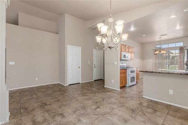 8266 Lincoln Valley St, Las Vegas, NV 89123 - kitchen with white appliances, a chandelier, baseboards, hanging light fixtures, and recessed lighting