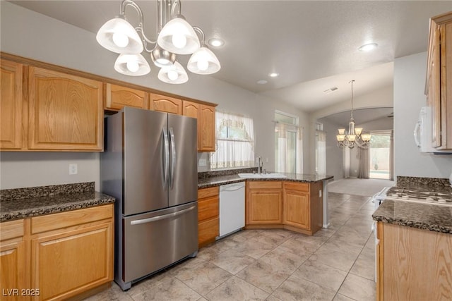 8266 Lincoln Valley St, Las Vegas, NV 89123 - kitchen with white appliances, a chandelier, healthy amount of natural light, a peninsula, and lofted ceiling