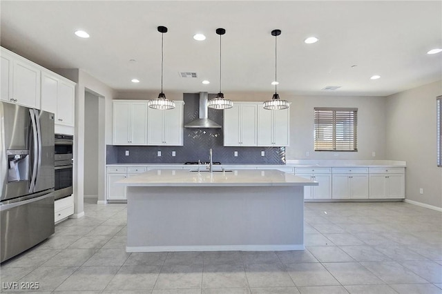 701 Monroe Hill Pl, Henderson, NV 89011 - kitchen featuring appliances with stainless steel finishes, wall chimney range hood, light countertops, recessed lighting, and backsplash