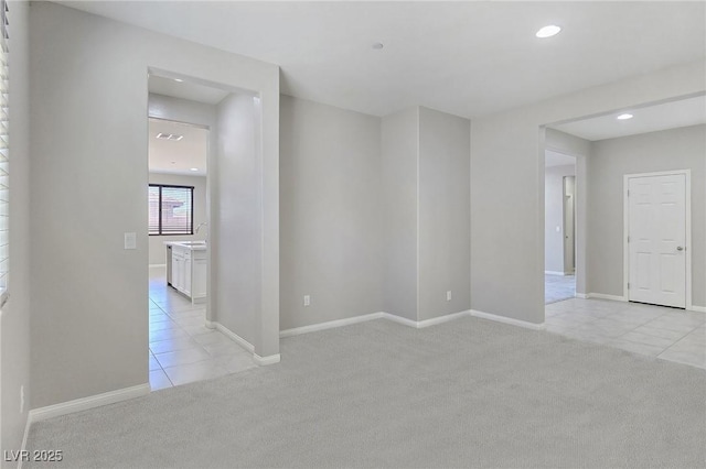 701 Monroe Hill Pl, Henderson, NV 89011 - unfurnished room with light carpet, light tile patterned floors, recessed lighting, and baseboards