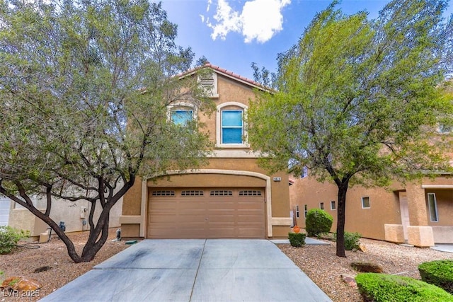 9629 Toy Soldier St, Las Vegas, NV 89178 - view of front of home with concrete driveway, stucco siding, and an attached garage