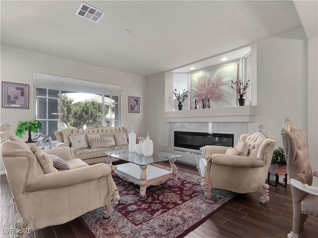 6465 Grande River Ct, Las Vegas, NV 89139 - living room with wood finished floors, a high end fireplace, recessed lighting, and baseboards