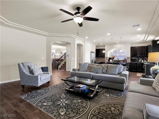 6465 Grande River Ct, Las Vegas, NV 89139 - living room with arched walkways, ceiling fan, wood finished floors, baseboards, and recessed lighting