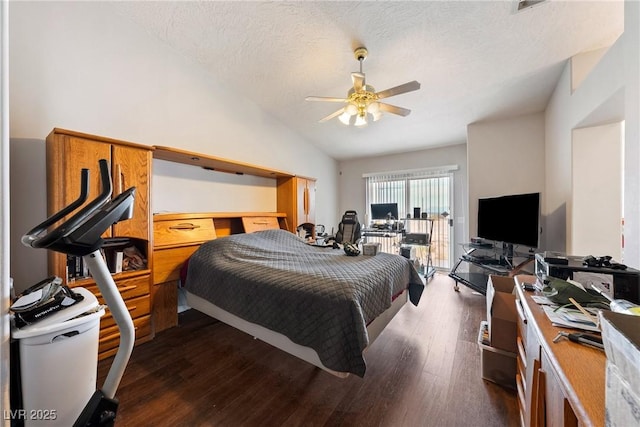 3481 Winery Rd, Pahrump, NV 89048 - bedroom with vaulted ceiling, dark wood-style floors, a textured ceiling, and a ceiling fan