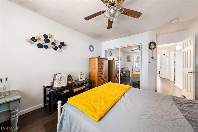 3481 Winery Rd, Pahrump, NV 89048 - bedroom with wood finished floors, baseboards, a closet, and a ceiling fan