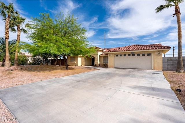 3481 Winery Rd, Pahrump, NV 89048 - view of front facade featuring stucco siding, driveway, a garage, and a tile roof