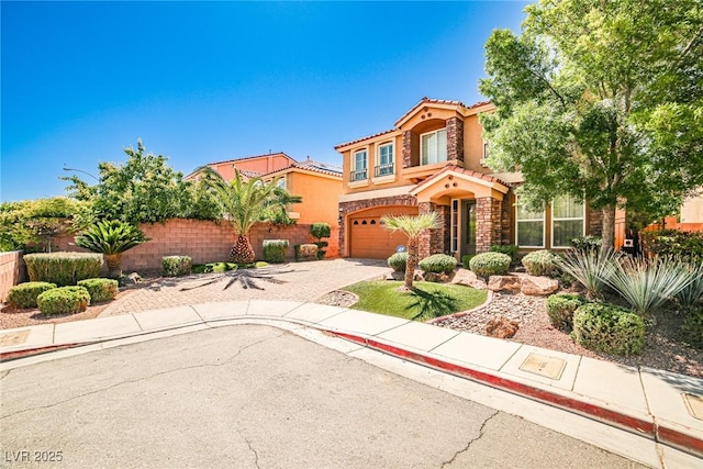 6409 Shawnee Springs Ct, Las Vegas, NV 89139 - mediterranean / spanish home featuring fence, a tiled roof, a garage, and stucco siding