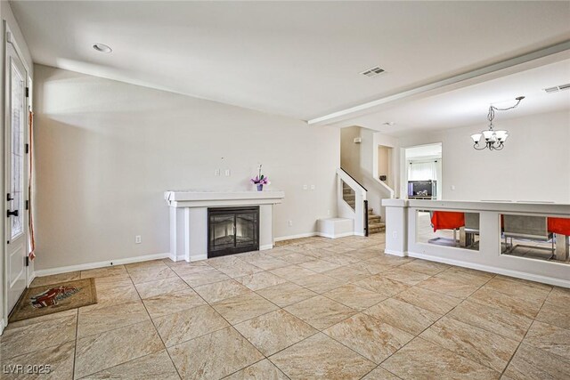6409 Shawnee Springs Ct, Las Vegas, NV 89139 - unfurnished living room with stairs, a fireplace, a chandelier, and baseboards