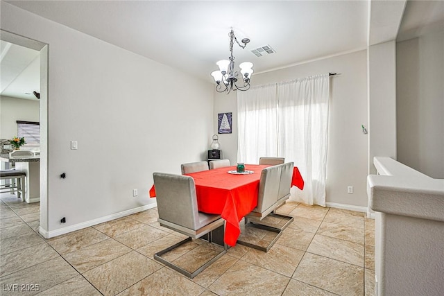6409 Shawnee Springs Ct, Las Vegas, NV 89139 - dining area with a chandelier, light tile patterned floors, and baseboards