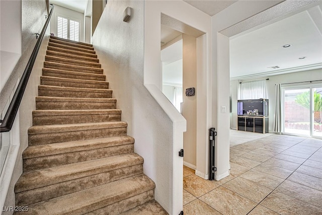 6409 Shawnee Springs Ct, Las Vegas, NV 89139 - stairs with tile patterned flooring, plenty of natural light, and baseboards