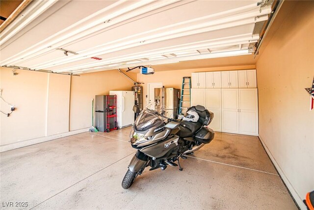 6409 Shawnee Springs Ct, Las Vegas, NV 89139 - garage featuring freestanding refrigerator, a garage door opener, and water heater