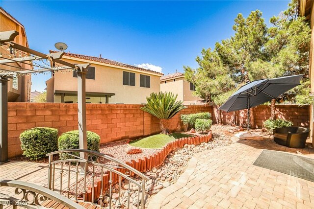 6409 Shawnee Springs Ct, Las Vegas, NV 89139 - view of patio featuring a fenced backyard and a pergola