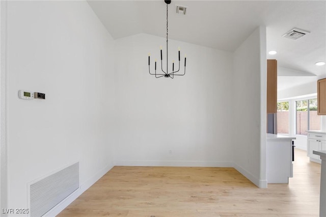 2913 Hawksdale Dr, Las Vegas, NV 89134 - unfurnished dining area featuring vaulted ceiling, a chandelier, light wood-style floors, recessed lighting, and baseboards