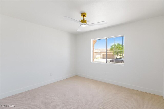 2913 Hawksdale Dr, Las Vegas, NV 89134 - spare room with baseboards, light colored carpet, and ceiling fan