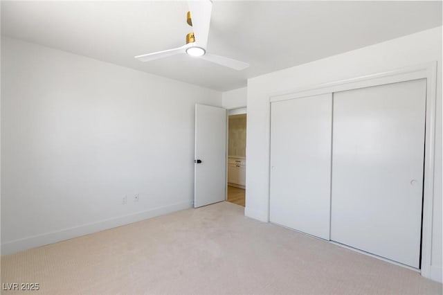 2913 Hawksdale Dr, Las Vegas, NV 89134 - unfurnished bedroom with light colored carpet, a closet, baseboards, and ceiling fan