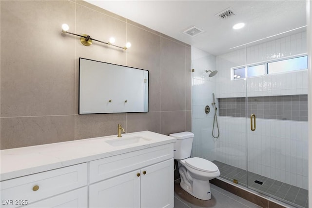 2913 Hawksdale Dr, Las Vegas, NV 89134 - full bath featuring toilet, a stall shower, tile walls, and vanity