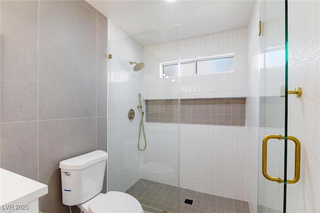 2913 Hawksdale Dr, Las Vegas, NV 89134 - bathroom featuring toilet, a stall shower, tile walls, and vanity