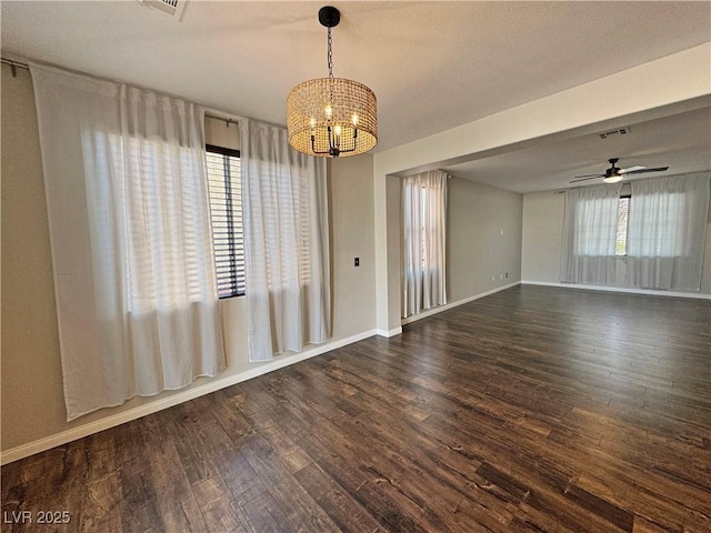 3938 E Chaffe Ave, Pahrump, NV 89061 - empty room featuring a chandelier, wood finished floors, baseboards, and ceiling fan